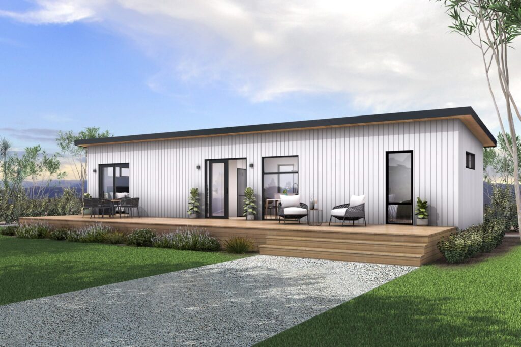Exterior of a two-bedroom relocatable home NZ featuring timber decking, white vertical cladding and black joinery — contemporary design by Paragon Portables.
