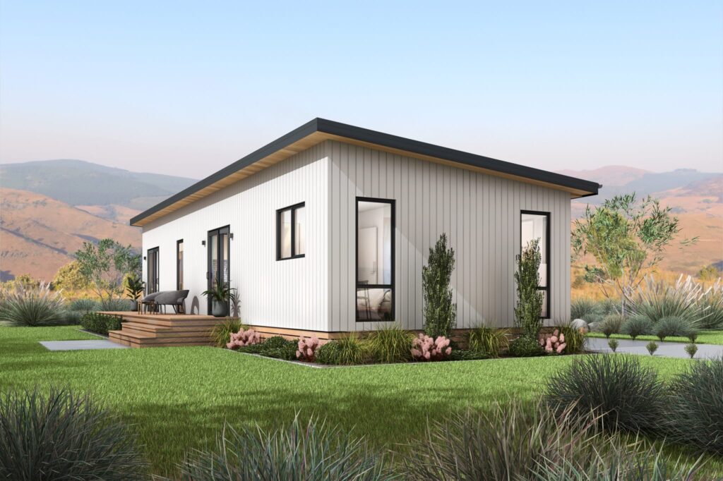 Three-bedroom transportable home NZ with vertical white cladding, black roofline and landscaped garden — designed by Paragon Portables for modern family living.