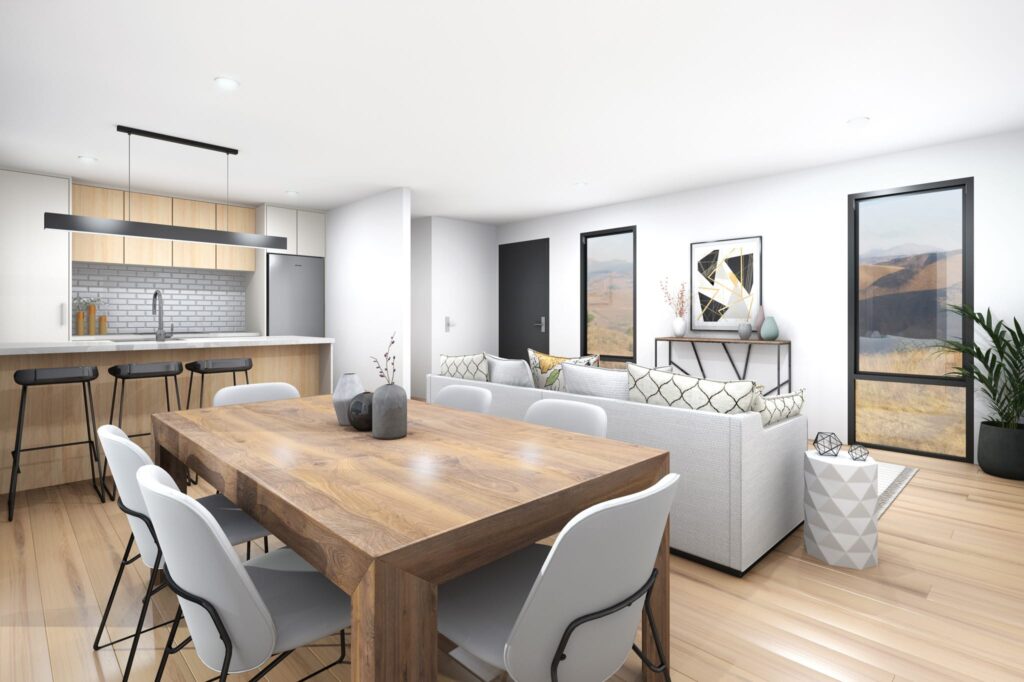 Spacious open-plan kitchen and living area in a three-bedroom portable home NZ, featuring light timber floors and modern furnishings.