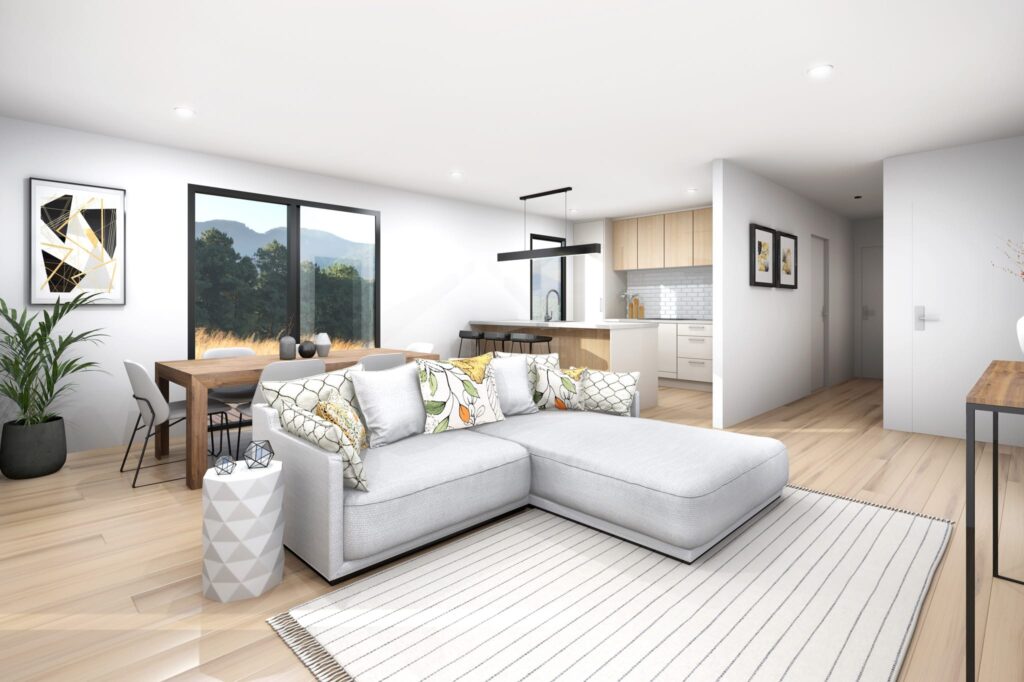 Contemporary living room and dining area in a three-bedroom relocatable home NZ, showcasing open-plan layout and natural light.