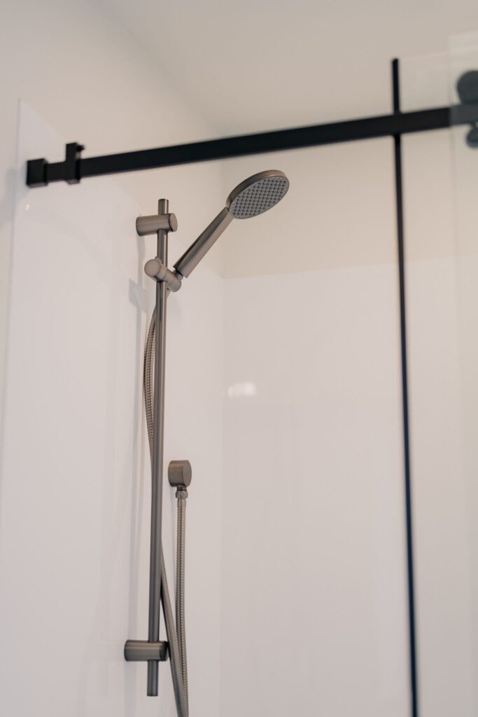 Sleek shower fixture inside a Paragon Portables portable home NZ — elegant bathroom design for small modern homes.