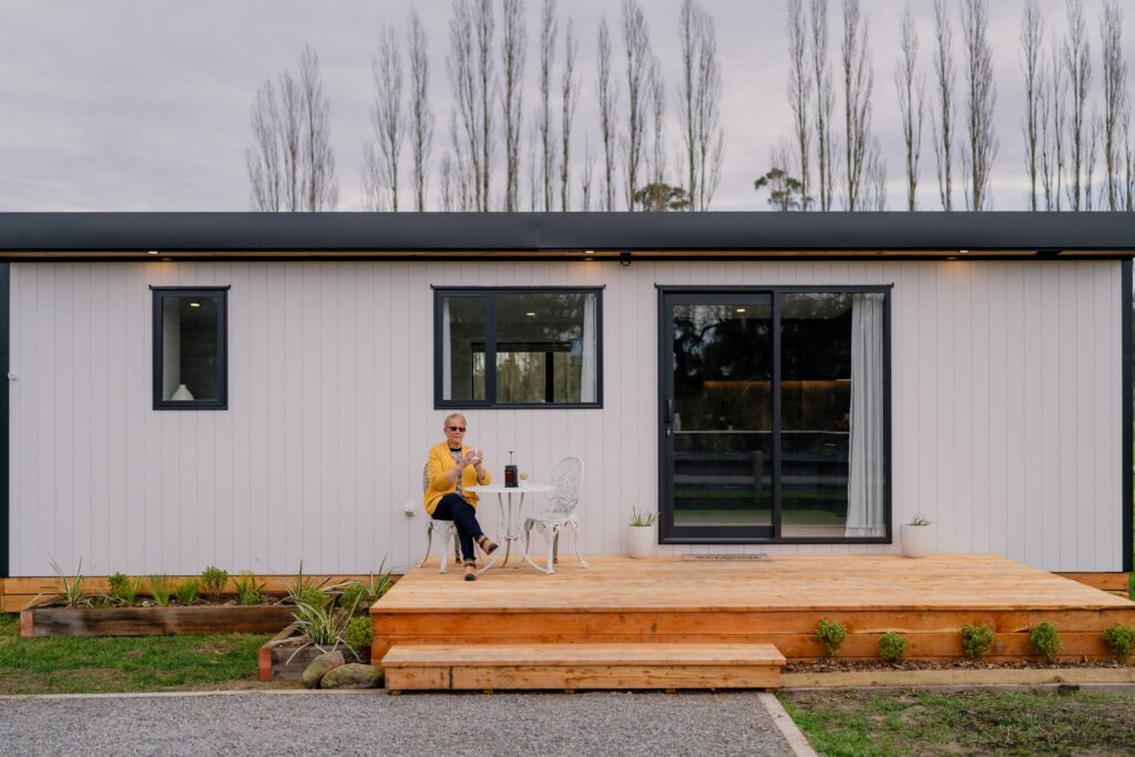 Exterior view of a completed portable house NZ with deck and landscaping, highlighting relocatable homes and affordable eco-friendly housing options in New Zealand.